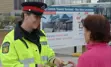Police officer handing out items