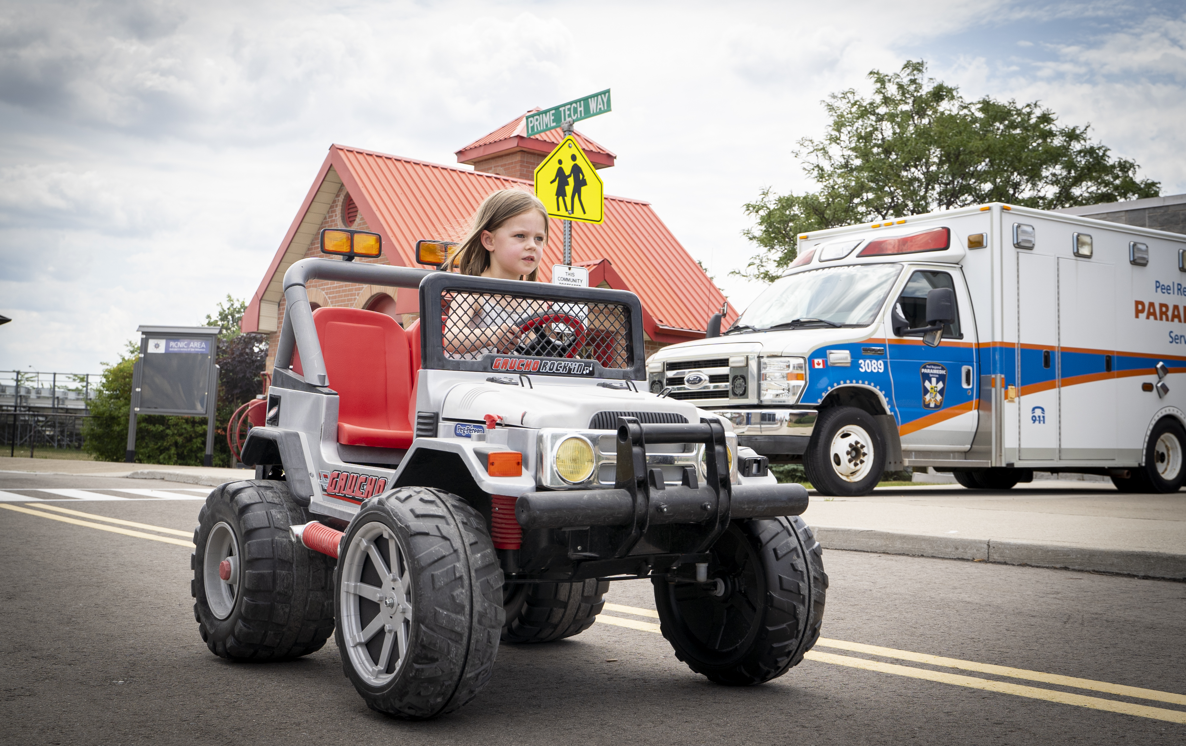 little girl riding toy jeep