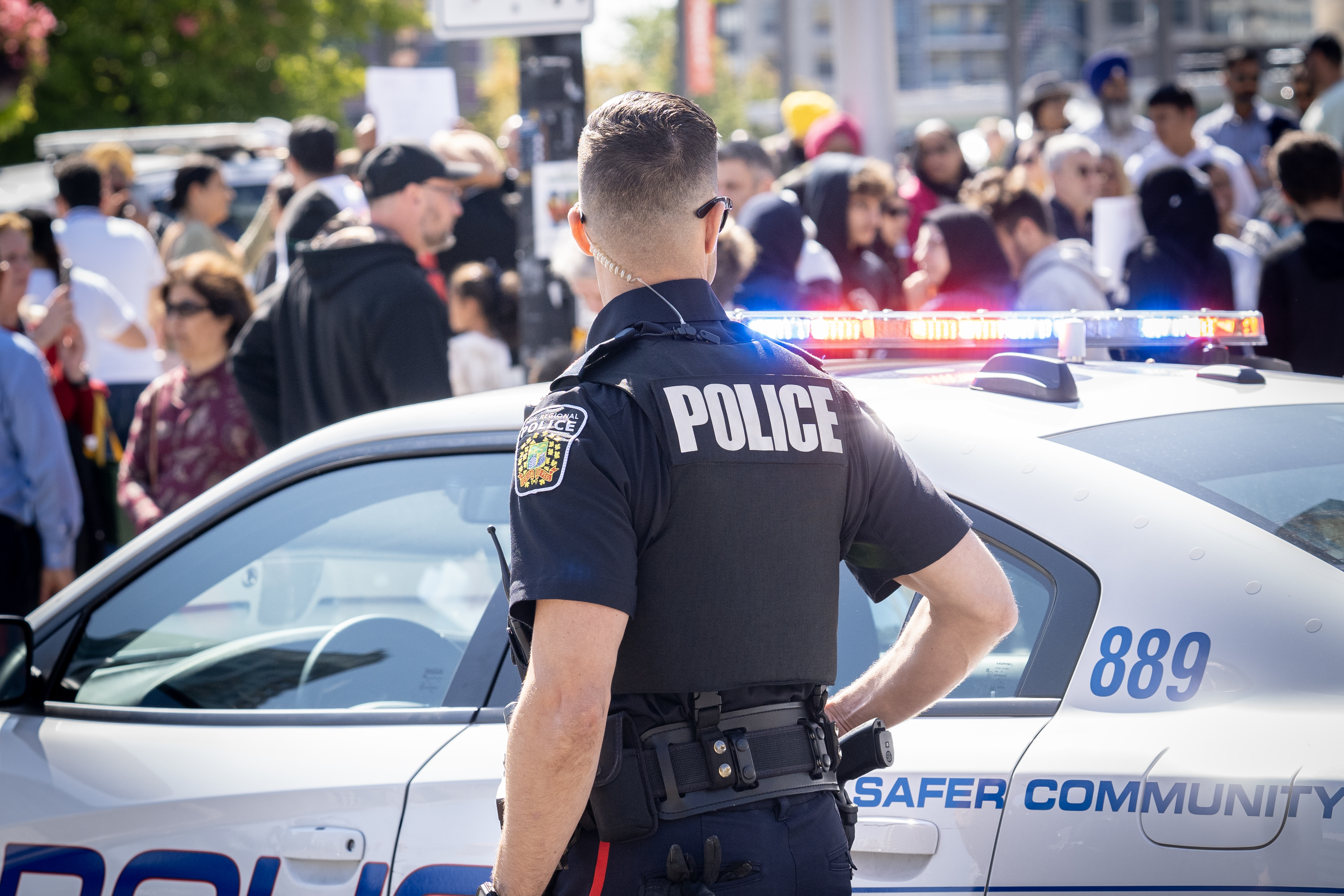 Police officer watches crowd