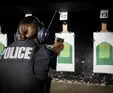female officer practicing in gun range