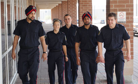 Group of young happy employees walking together