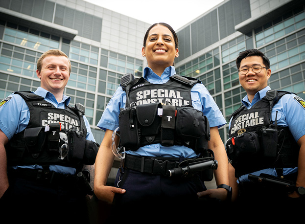 3 smiling prisoner escort officers