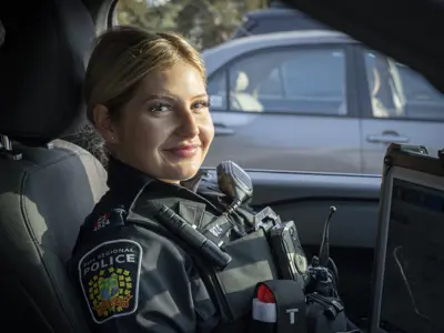 Female police officer in cruiser
