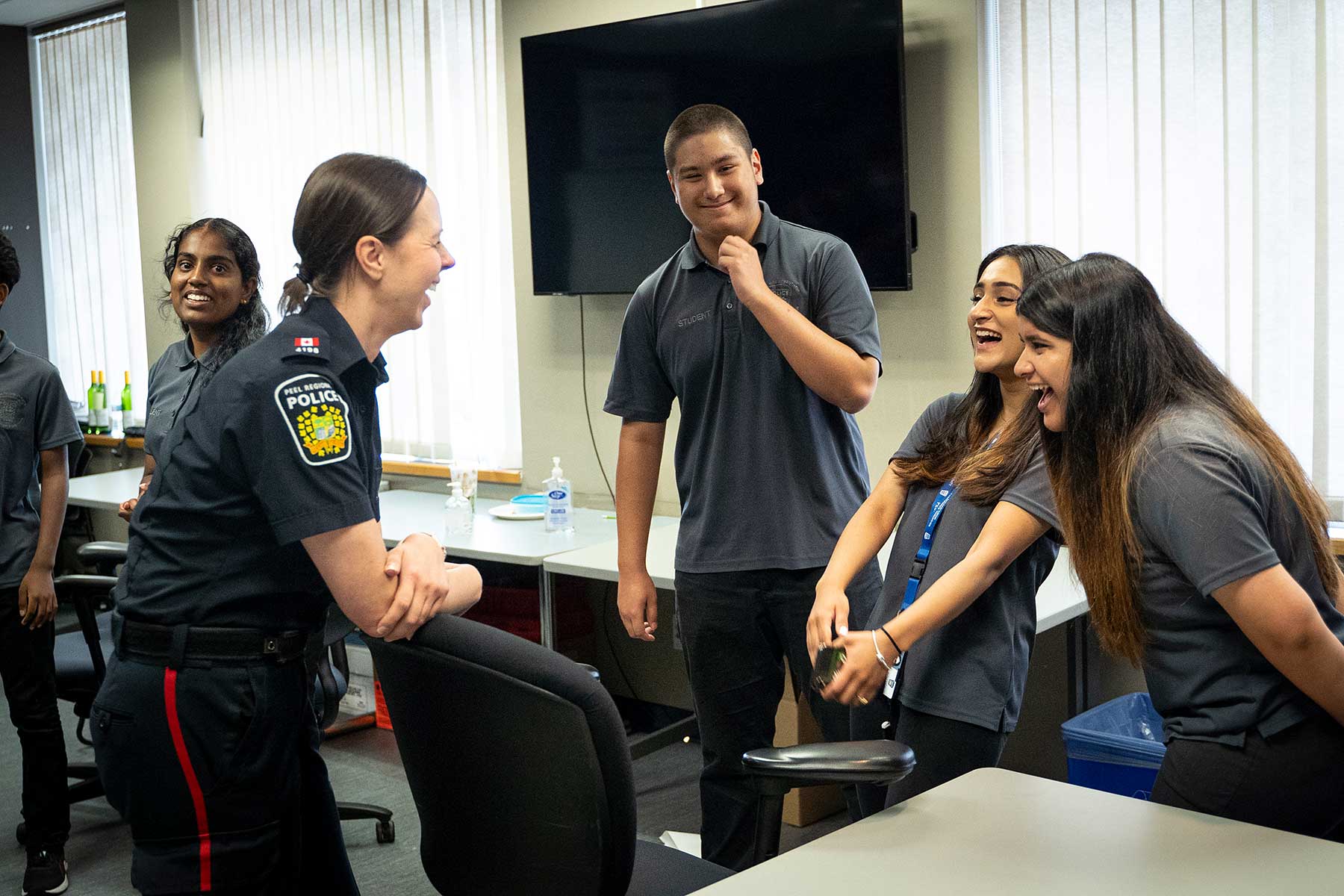 YIPI students and officer laughing