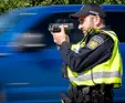 male officer using speed radar