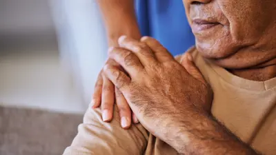Support, care and helping hands for an elderly patient during a consultation at a nursing clinic
