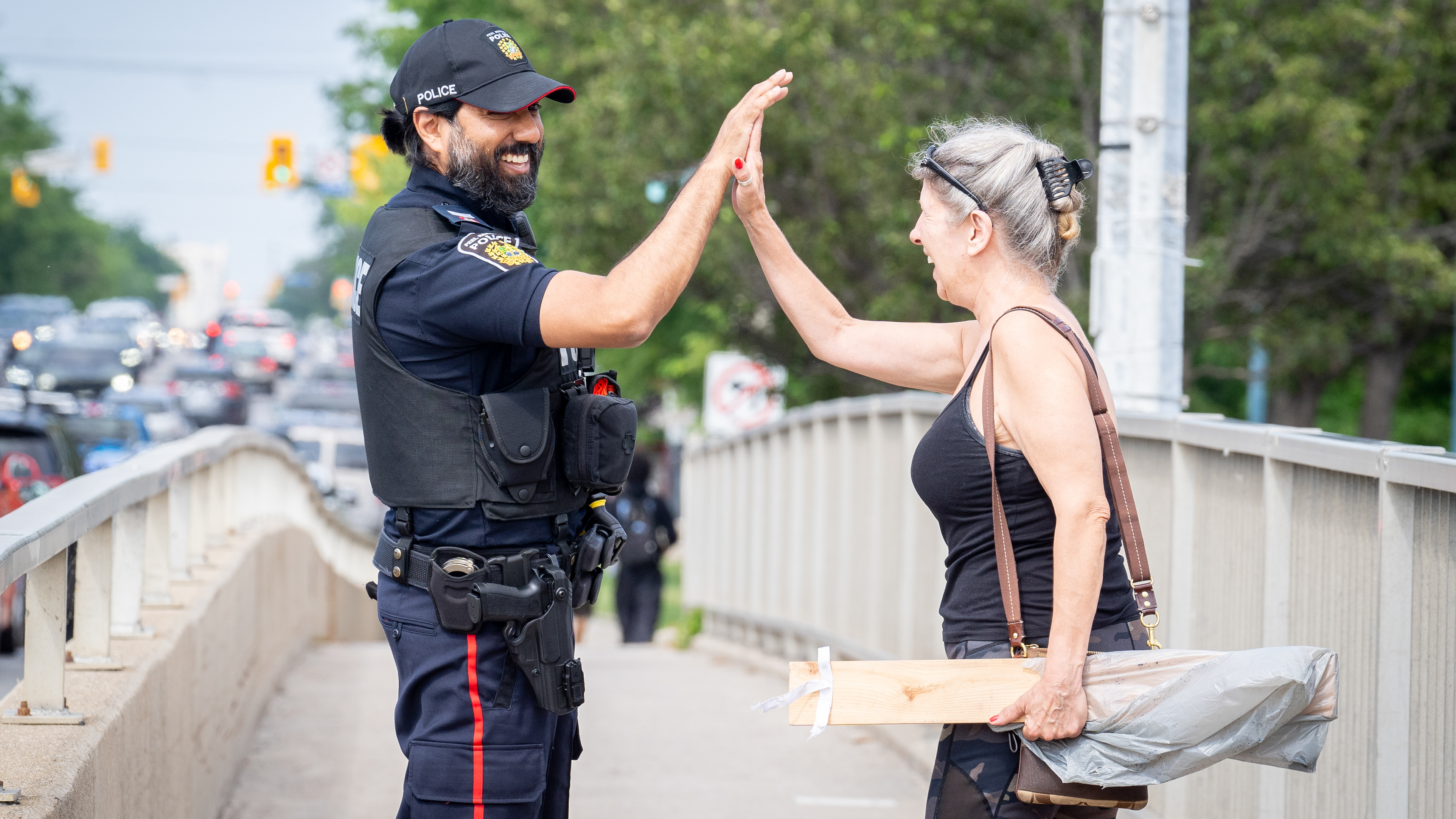 Police Officer high-fiving citizen