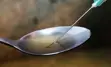 drugs in spoon with needle